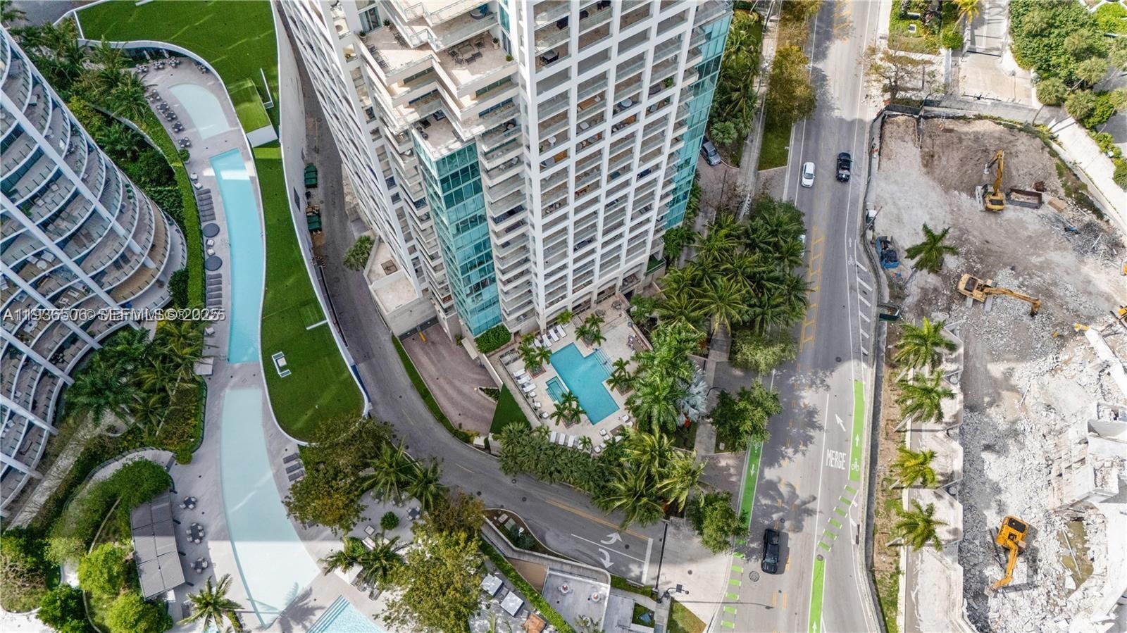 3400 Southwest 27th Avenue, Unit 605 Miami, FL 33133 - Photo 27 of 34 an aerial view of a residential apartment building with plants