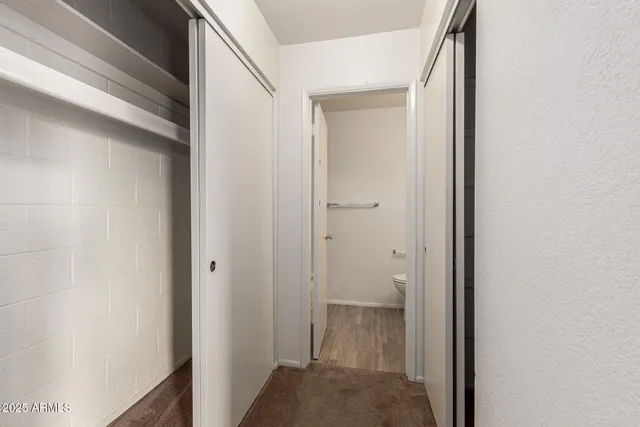 a view of a hallway with the wooden floor