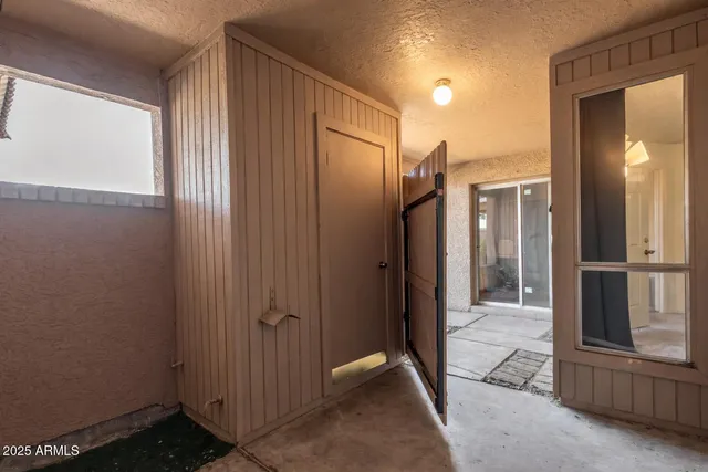 a view of a hallway with closet area
