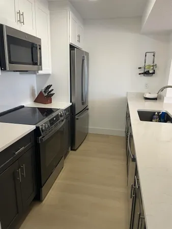 a view of a chairs and table in the balcony