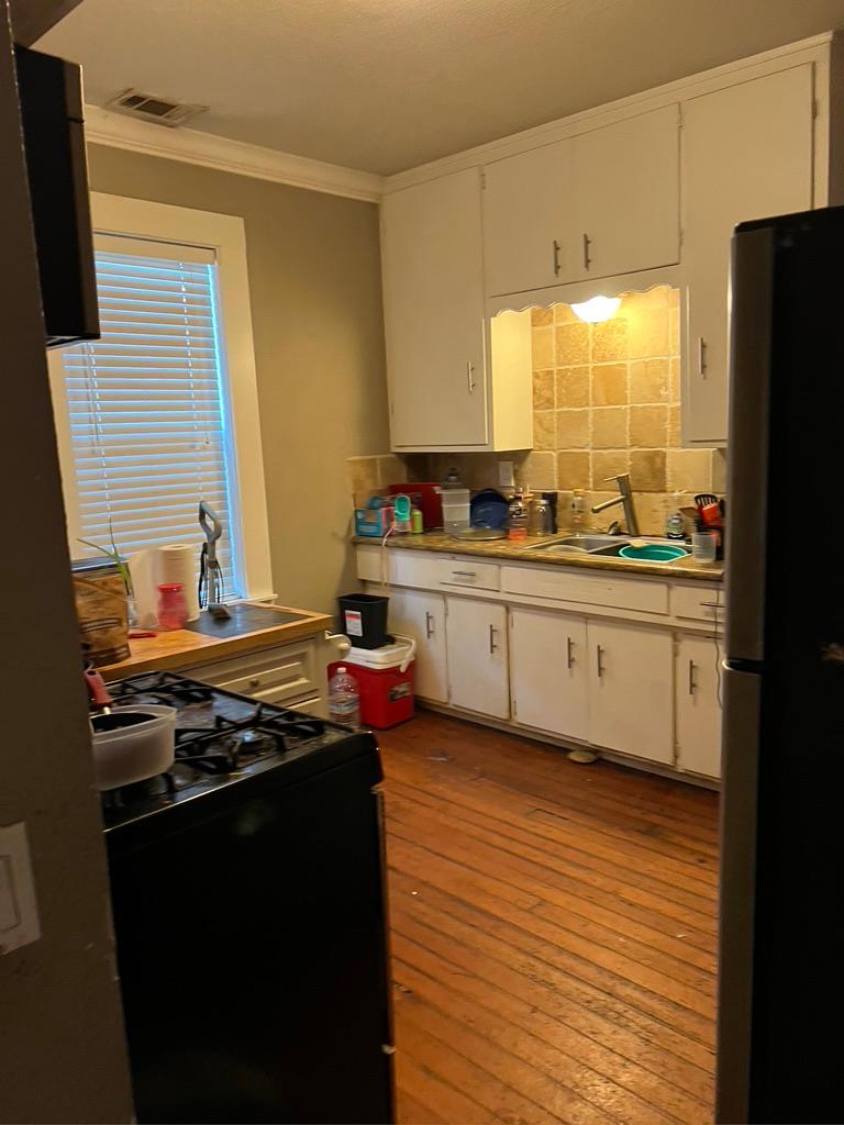 533 Reeves Avenue Yuba City, CA 95991 - Photo 22 of 48 a kitchen with stainless steel appliances a sink stove and refrigerator