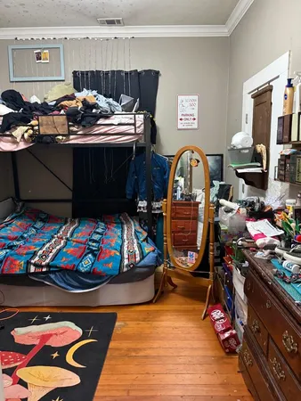 a bedroom with furniture and a window