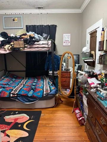 a bedroom with furniture and a window