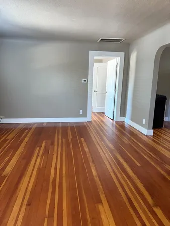 a view of a livingroom with wooden floor