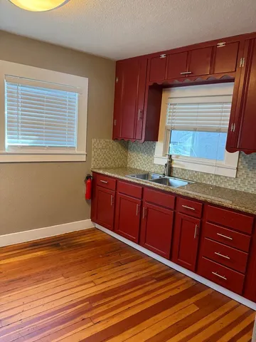 a view of a livingroom with wooden floor