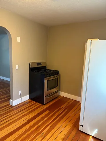 a empty closet with wooden floor