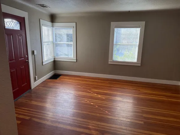 a empty closet with wooden floor
