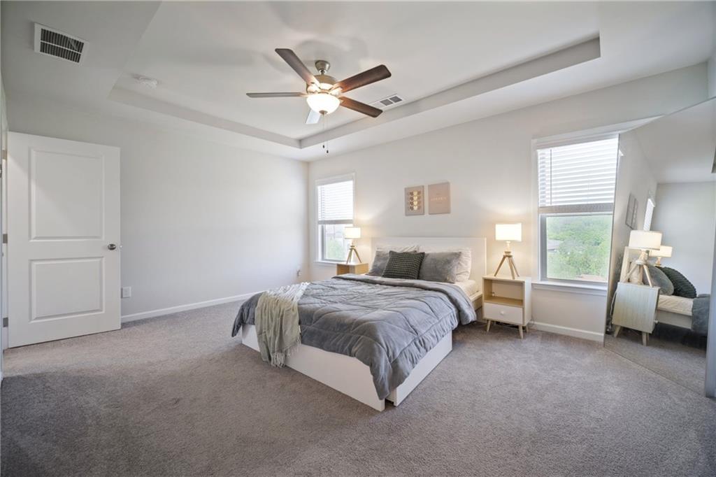 1595 Ridgebrook Downs Mableton, GA 30126 - Photo 19 of 39 a spacious bedroom with a bed and a window