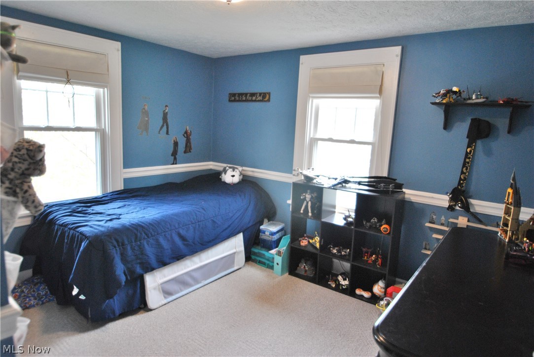 437 Malvern Road Akron, OH 44303 - Photo 12 of 19 Bedroom #2 has tranquil blue walls, wood floors, 2 windows w/shades and closet.