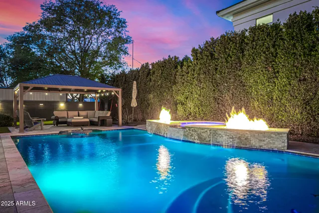 a view of a swimming pool with an outdoor space and seating area