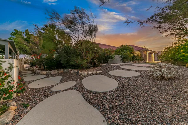 a view of a house with a backyard