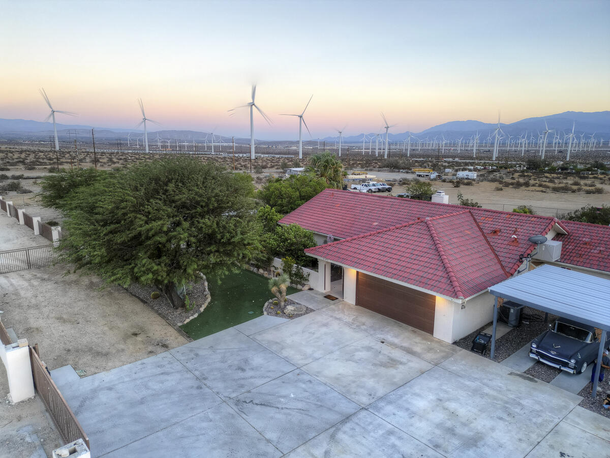 61895 Smoke Tree Road North Palm Springs, CA 92258 - Photo 29 of 88 a view of a patio with a table and chairs
