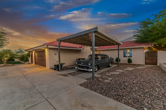 a view of a backyard with sitting area