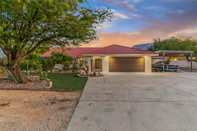 a view of a backyard with sitting area