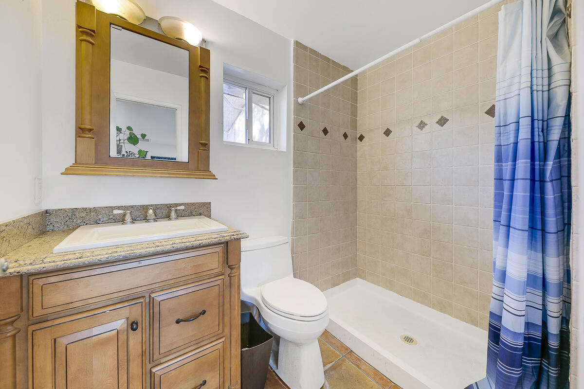 61895 Smoke Tree Road North Palm Springs, CA 92258 - Photo 55 of 88 a bathroom with a sink a toilet and shower