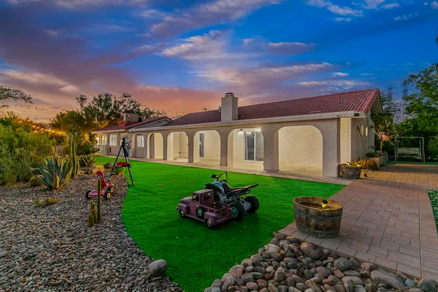 a view of a patio with a table and chairs