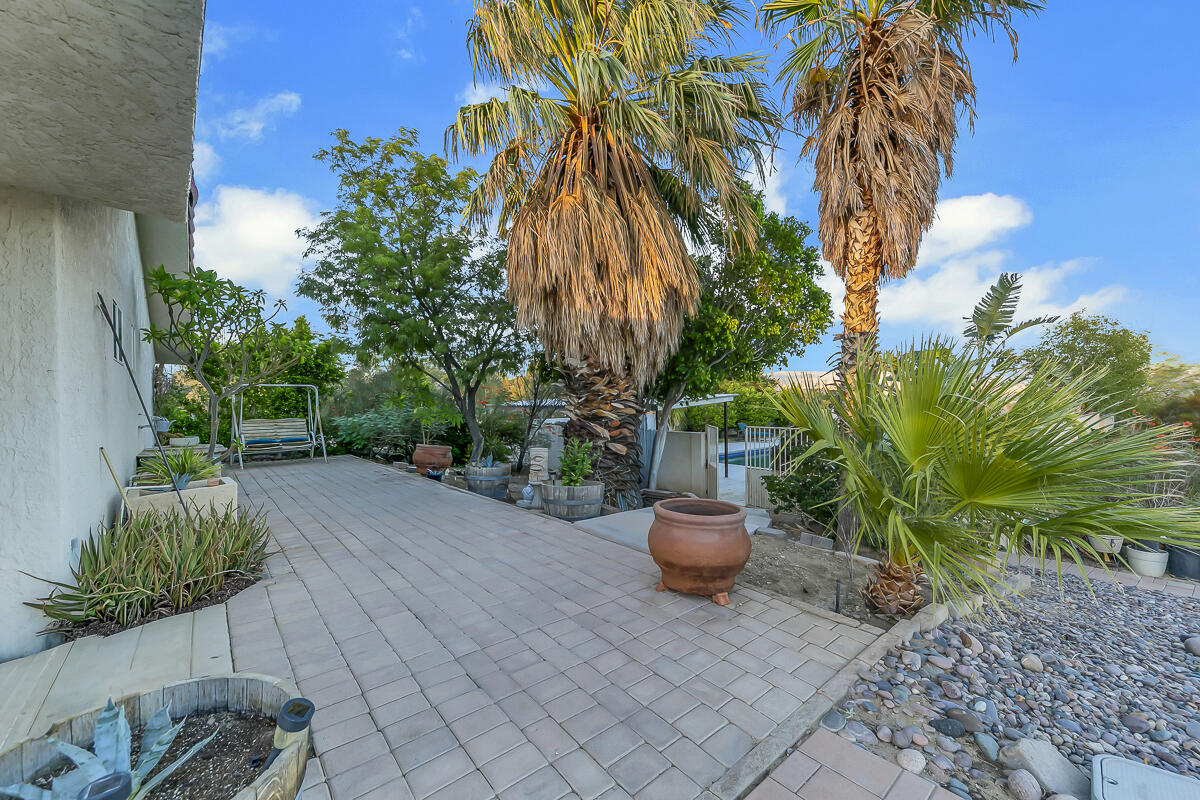 61895 Smoke Tree Road North Palm Springs, CA 92258 - Photo 70 of 88 a backyard of a house with outdoor seating
