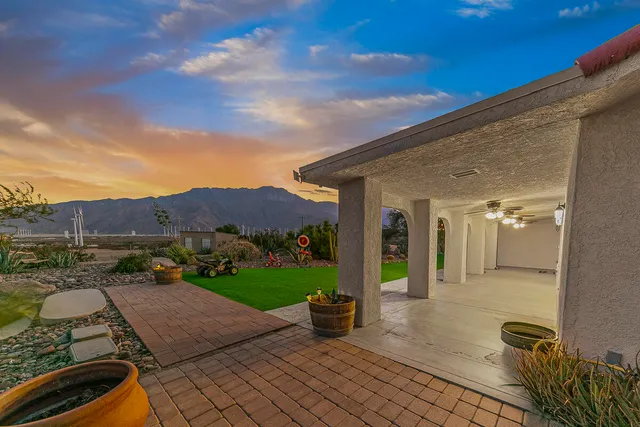 a view of a terrace with sitting area