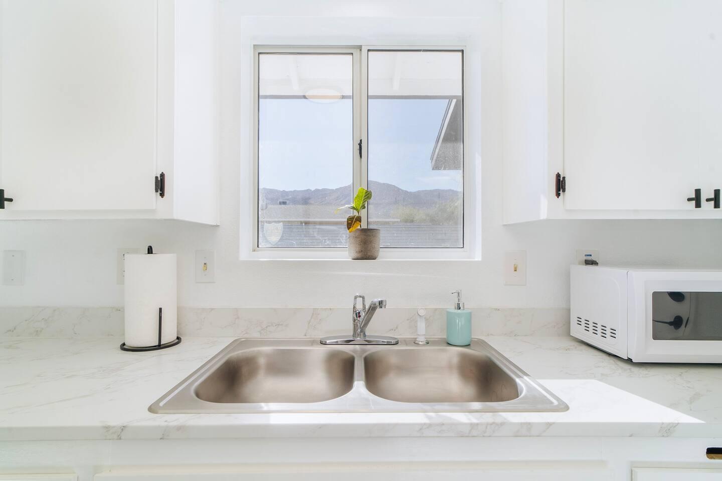 6635 Morongo Road Twentynine Palms, CA 92277 - Photo 14 of 31 a kitchen sink with a granite countertop window and sink