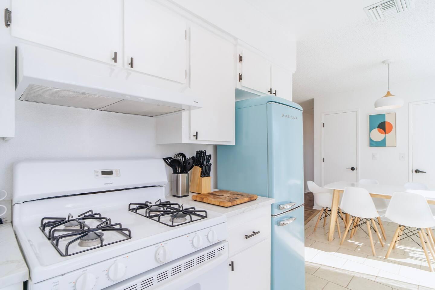 6635 Morongo Road Twentynine Palms, CA 92277 - Photo 15 of 31 a kitchen with stainless steel appliances granite countertop a stove and a refrigerator