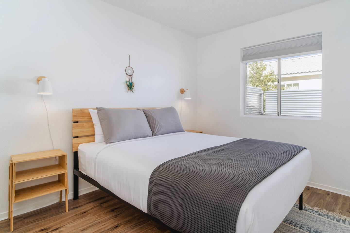 6635 Morongo Road Twentynine Palms, CA 92277 - Photo 17 of 31 a bedroom with a bed and a window