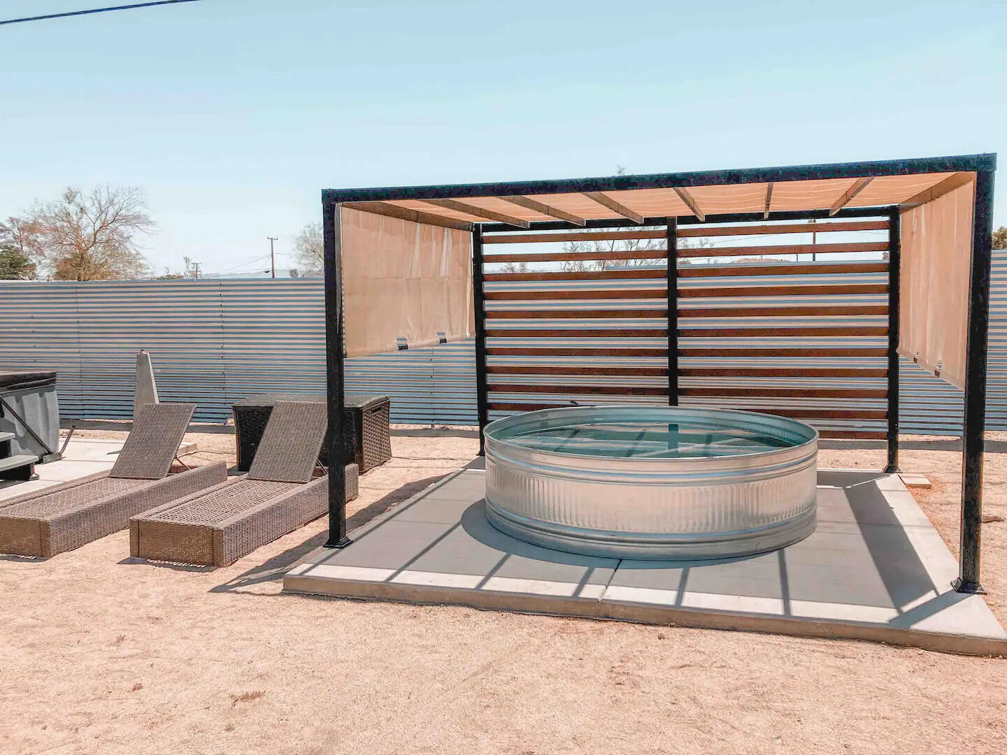 6635 Morongo Road Twentynine Palms, CA 92277 - Photo 31 of 31 a living room with a couch and a potted plant
