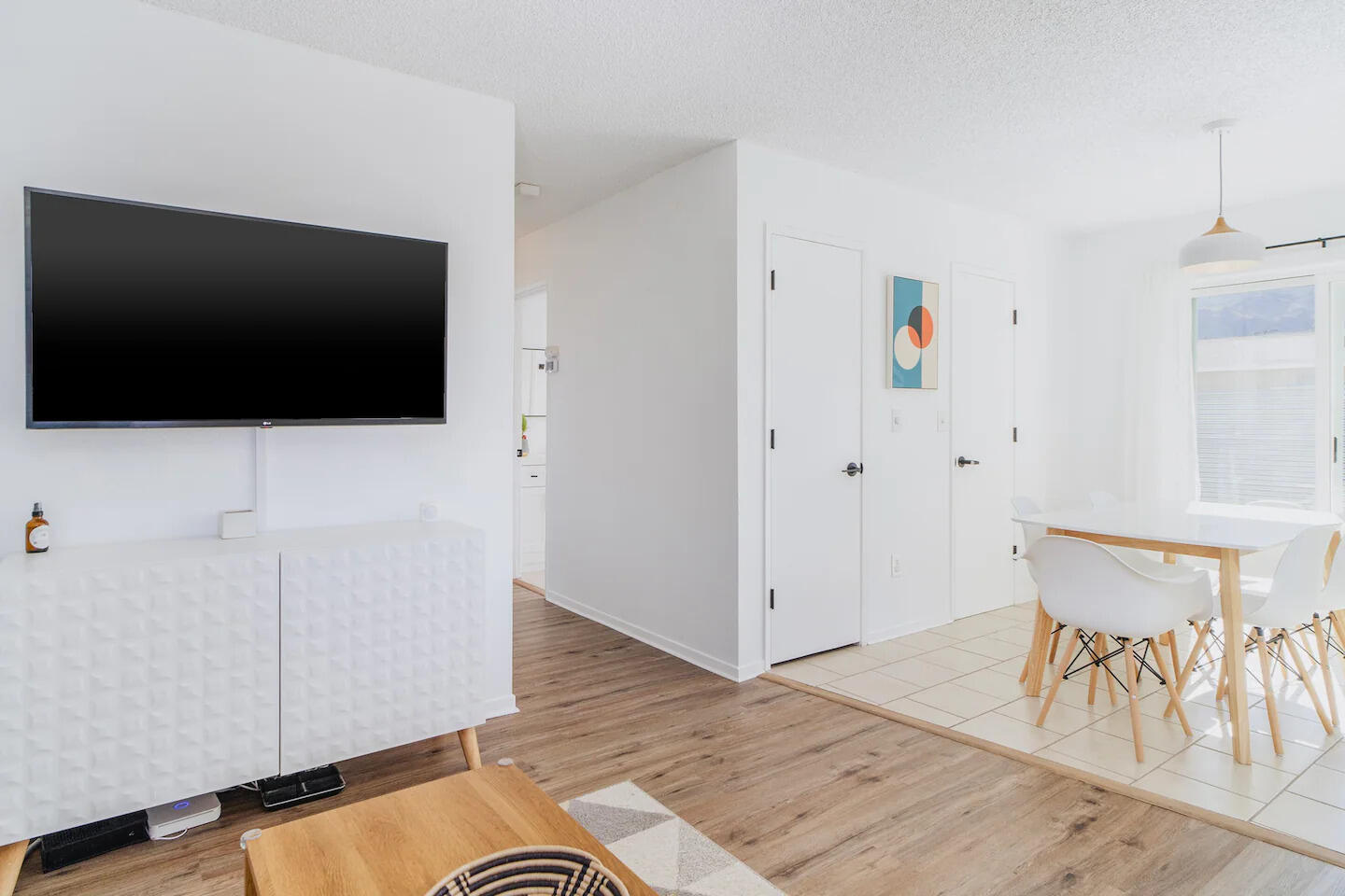6635 Morongo Road Twentynine Palms, CA 92277 - Photo 9 of 31 a view of a livingroom with wooden floor and a flat screen tv