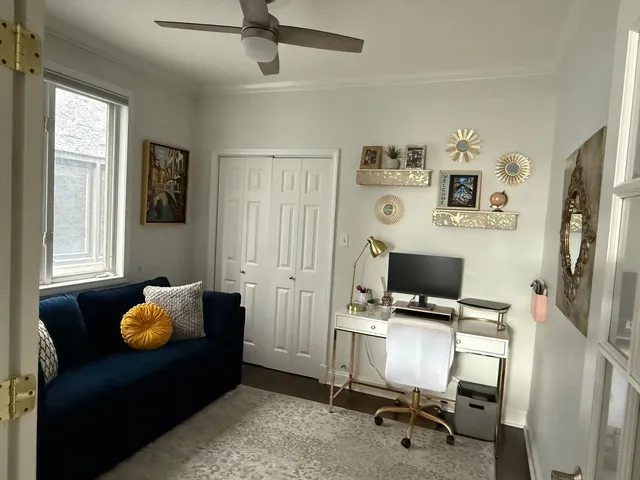 a workspace with furniture and window