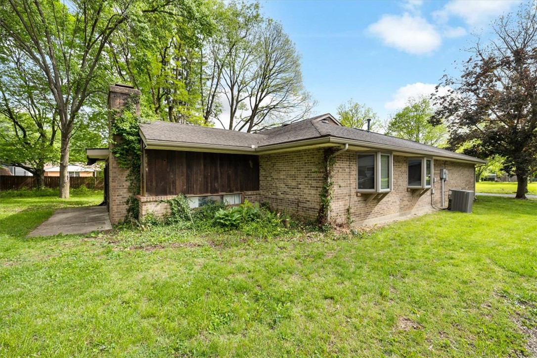 7225 Garber Road Clayton, OH 45415 - Photo 30 of 33 This classic brick residence features a durable roof and inviting bay windows.
