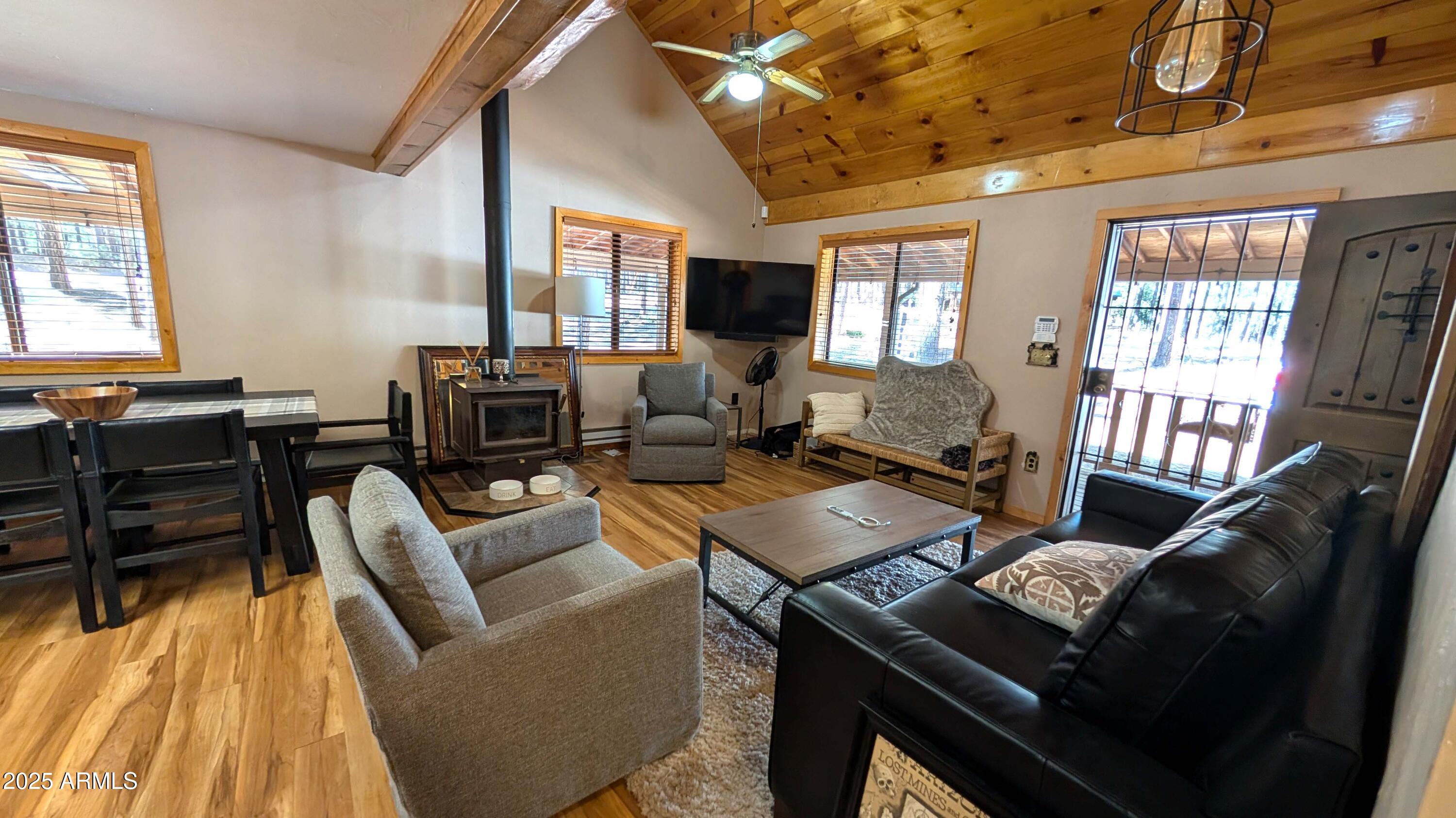 2425 Tall Trees Loop Forest Lakes, AZ 85931 - Photo 10 of 43 a living room with furniture and a flat screen tv