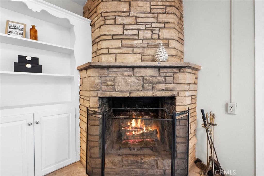 1101 Sharon Road Santa Ana, CA 92706 - Photo 16 of 53 Original stone fireplace and bookcase detail.