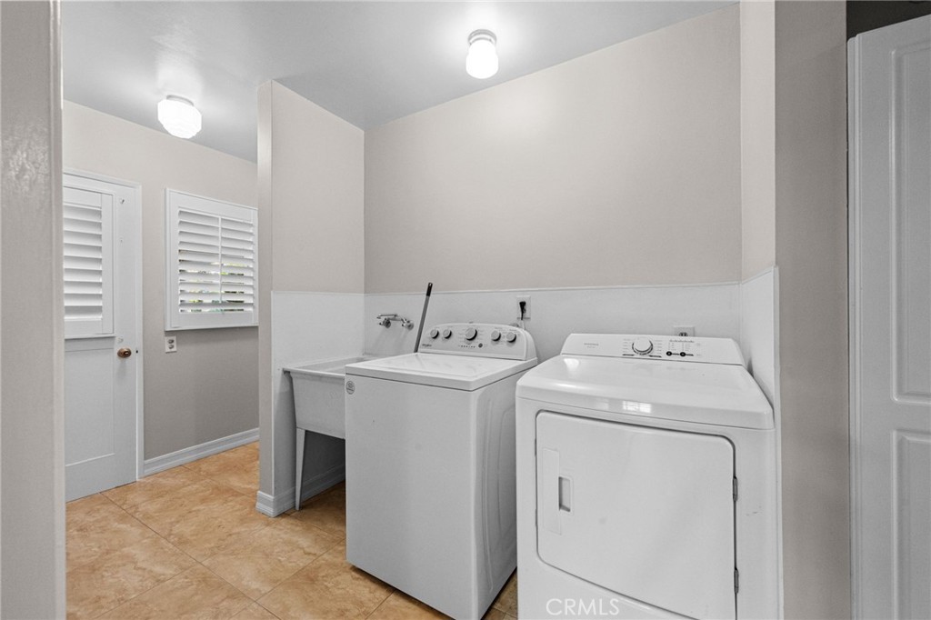 1101 Sharon Road Santa Ana, CA 92706 - Photo 36 of 53 Large Laundry with sink and storage opens to drive.