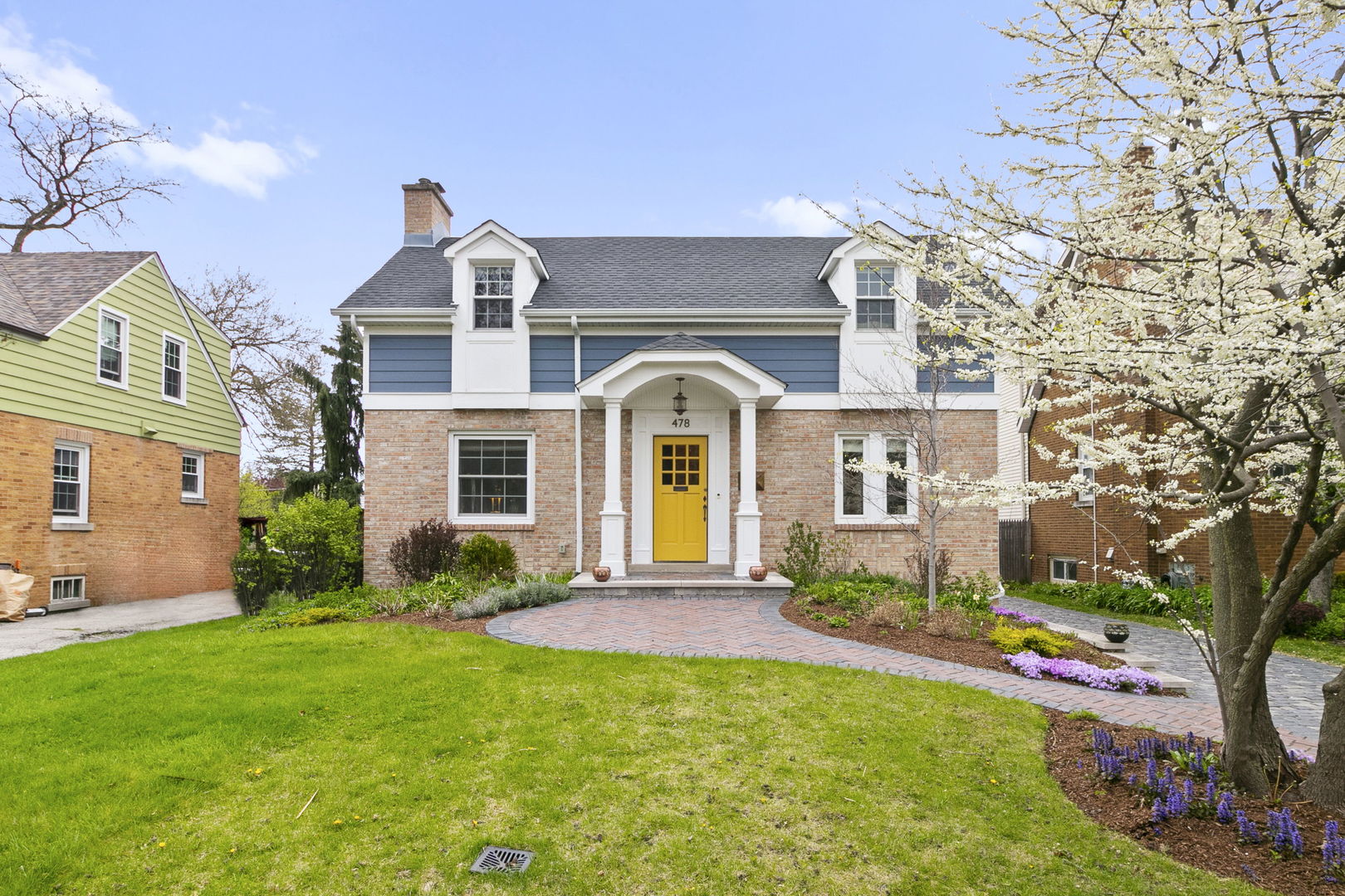 478 Uvedale Road Riverside, IL 60546 - Photo 1 of 40 a front view of a house with garden
