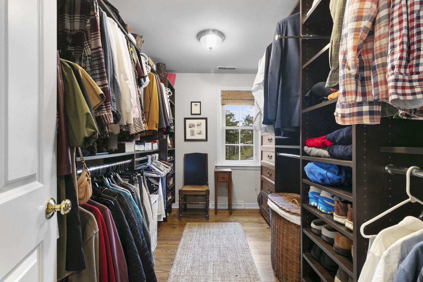 478 Uvedale Road Riverside, IL 60546 - Photo 17 of 40 a view of walk in closet with clothes and shoes