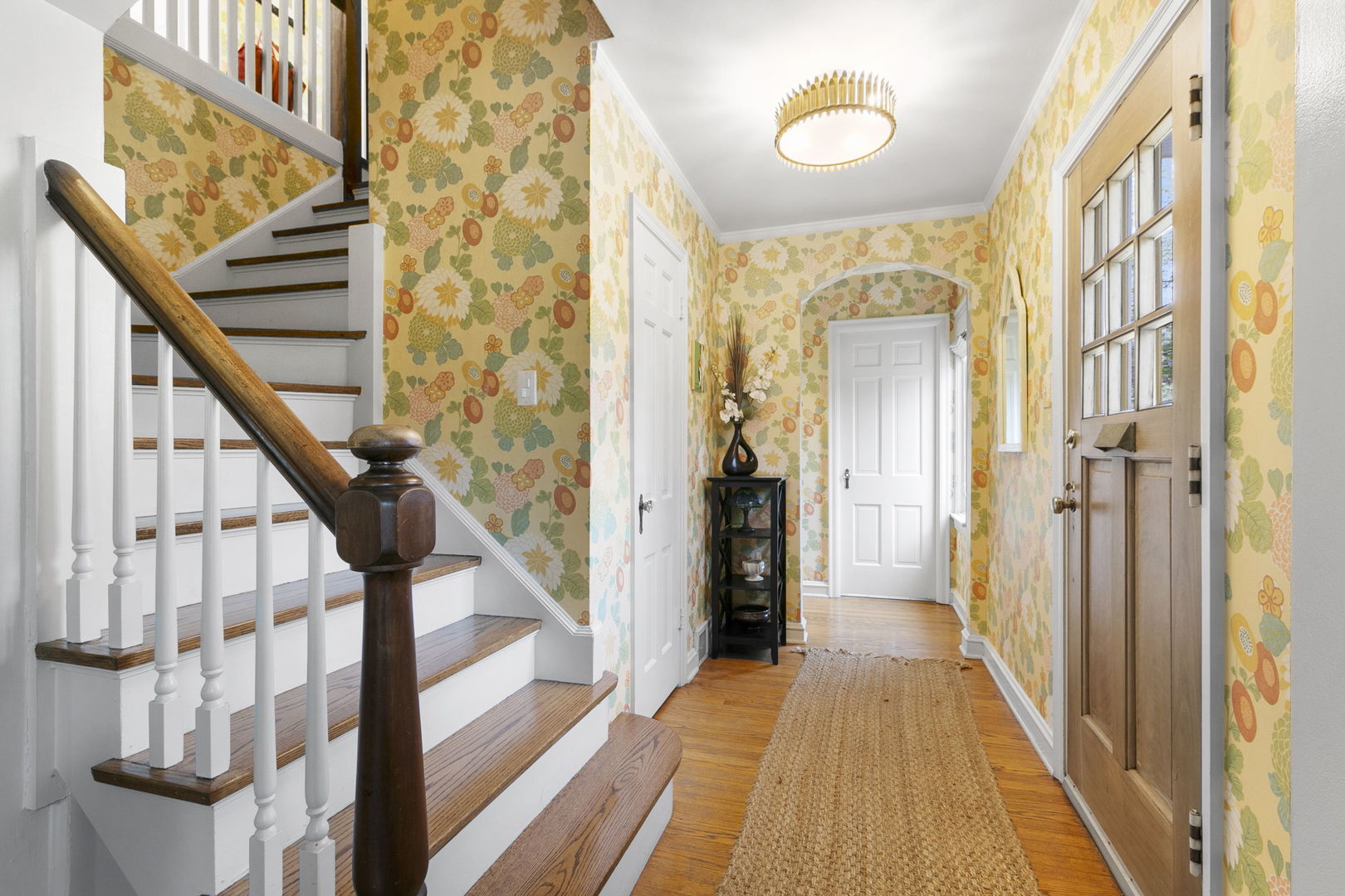 478 Uvedale Road Riverside, IL 60546 - Photo 2 of 40 a view of a hallway with wooden floor and staircase