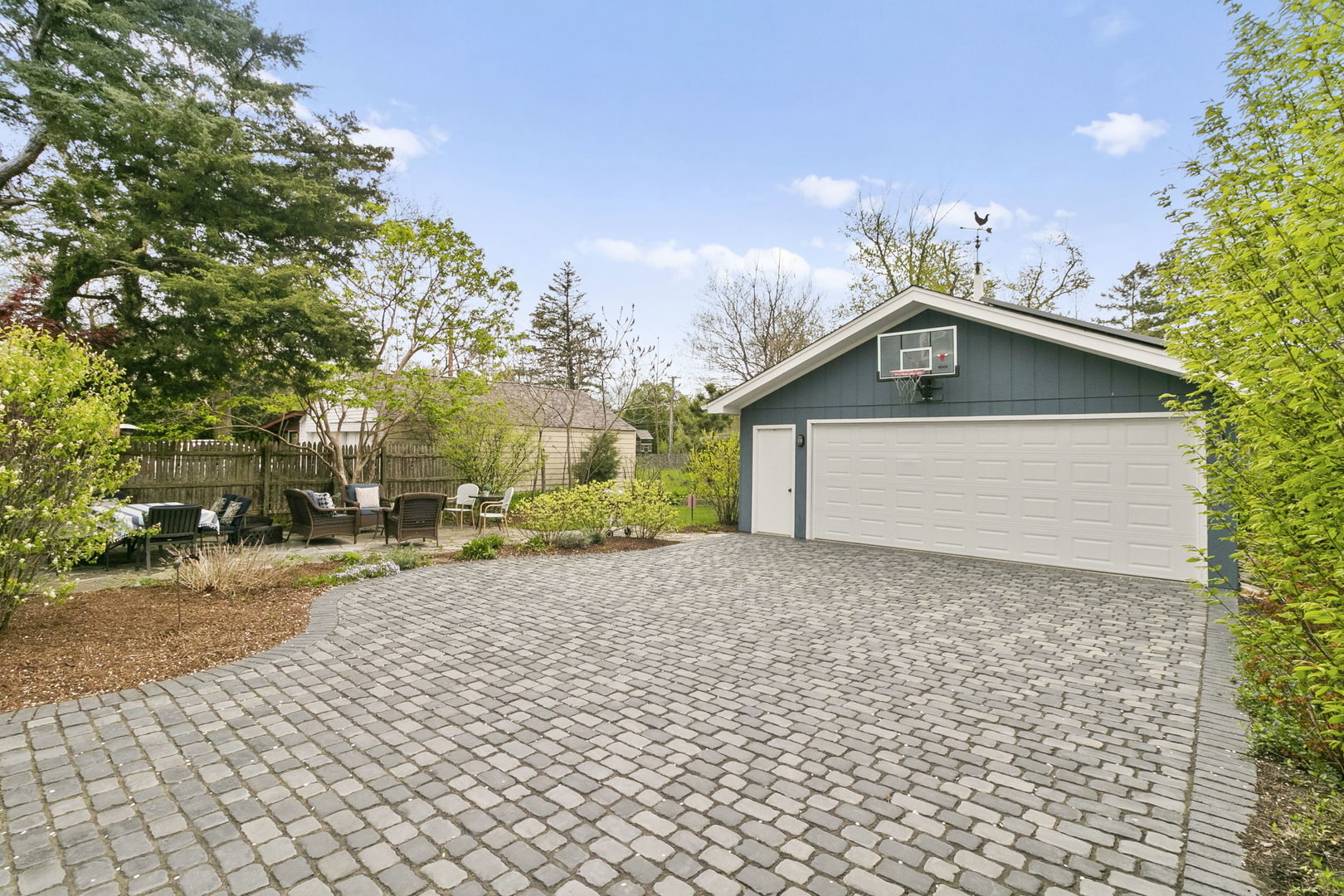 478 Uvedale Road Riverside, IL 60546 - Photo 25 of 40 a front view of a house with a yard and garage