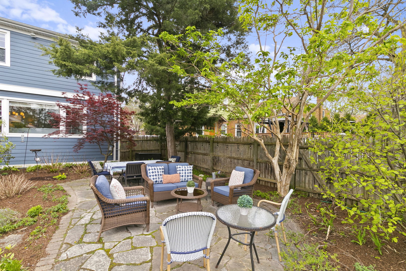 478 Uvedale Road Riverside, IL 60546 - Photo 27 of 40 a backyard of a house with fire pit and outdoor seating