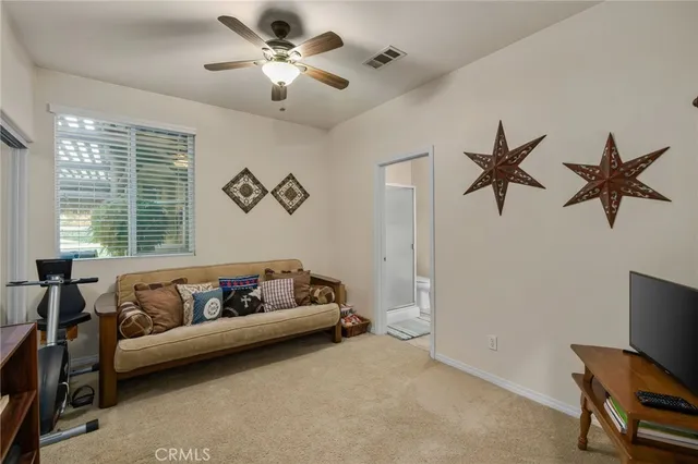 a living room with furniture and a window
