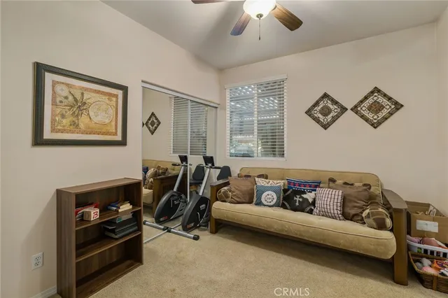 a living room with furniture and a window