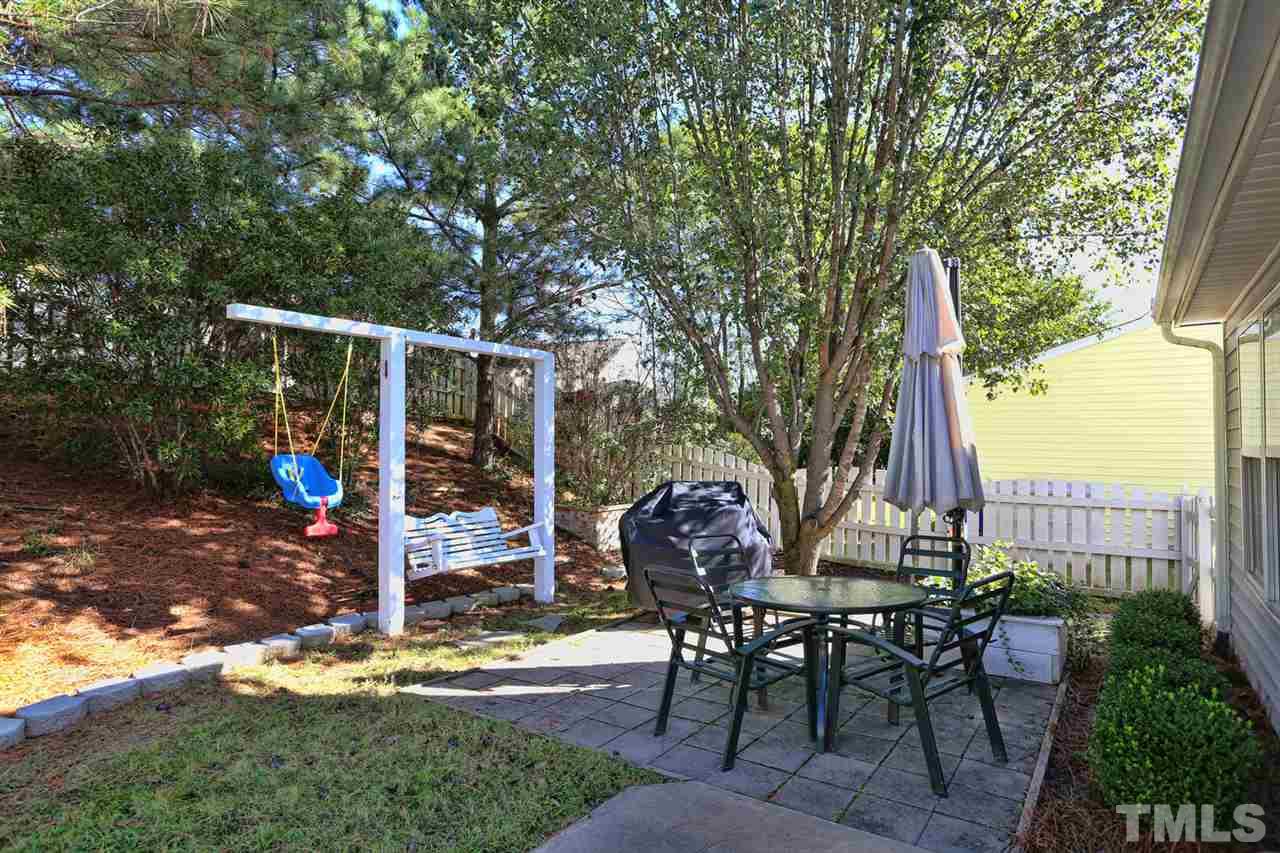 5033 Gable Ridge Drive Durham, NC 27713 - Photo 20 of 25 a view of a tables and chairs in patio