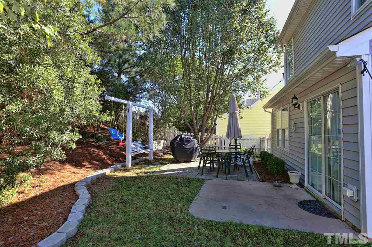 5033 Gable Ridge Drive Durham, NC 27713 - Photo 21 of 25 a view of a house with backyard sitting area and garden