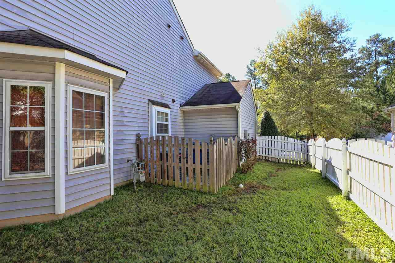 5033 Gable Ridge Drive Durham, NC 27713 - Photo 22 of 25 a view of a house with a yard