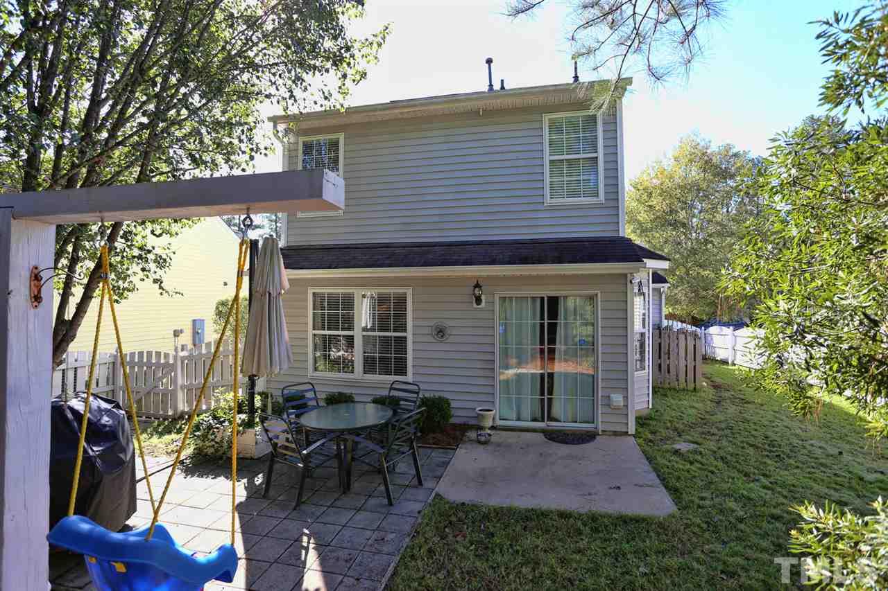 5033 Gable Ridge Drive Durham, NC 27713 - Photo 23 of 25 a view of a house with backyard sitting area and garden