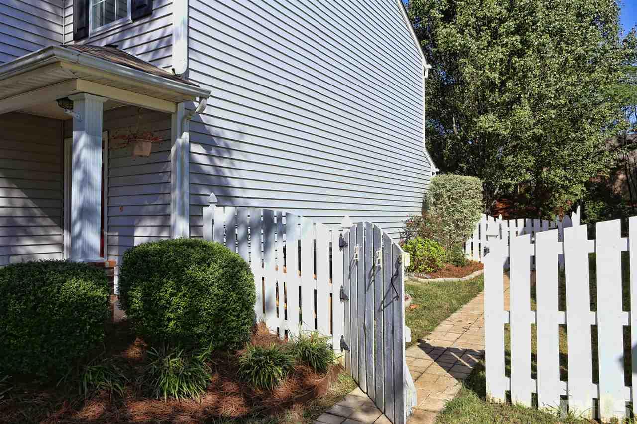 5033 Gable Ridge Drive Durham, NC 27713 - Photo 24 of 25 a view of a house with a small yard and plants