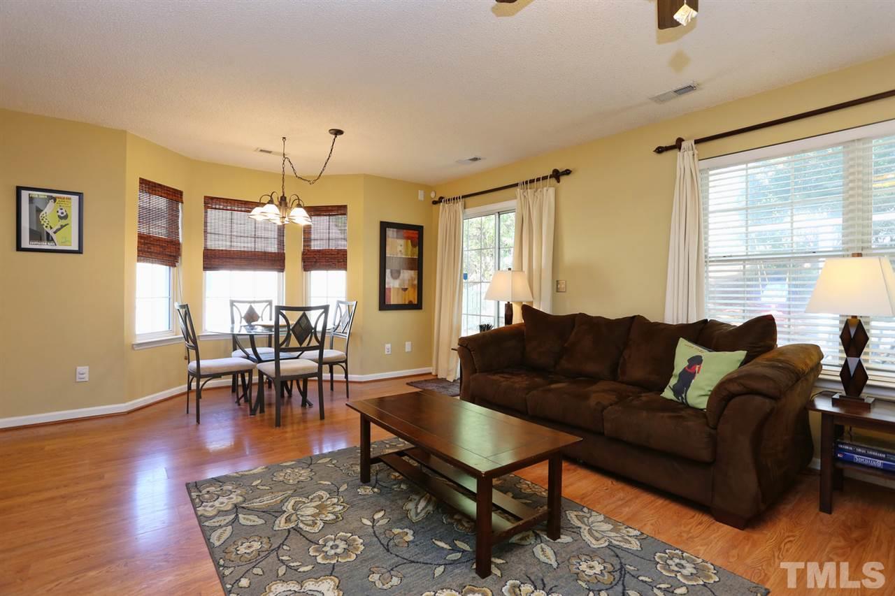 5033 Gable Ridge Drive Durham, NC 27713 - Photo 5 of 25 a living room with furniture potted plant and a window