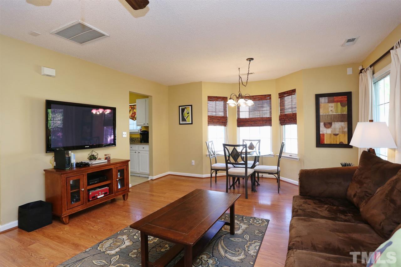 5033 Gable Ridge Drive Durham, NC 27713 - Photo 6 of 25 a living room with furniture and a flat screen tv