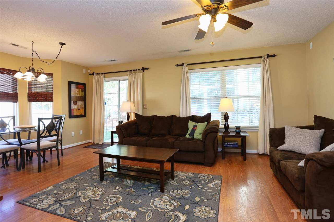 5033 Gable Ridge Drive Durham, NC 27713 - Photo 7 of 25 a living room with furniture and a wooden floor
