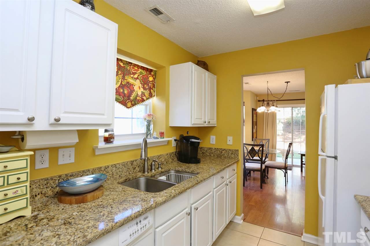 5033 Gable Ridge Drive Durham, NC 27713 - Photo 8 of 25 a kitchen with a refrigerator and a sink
