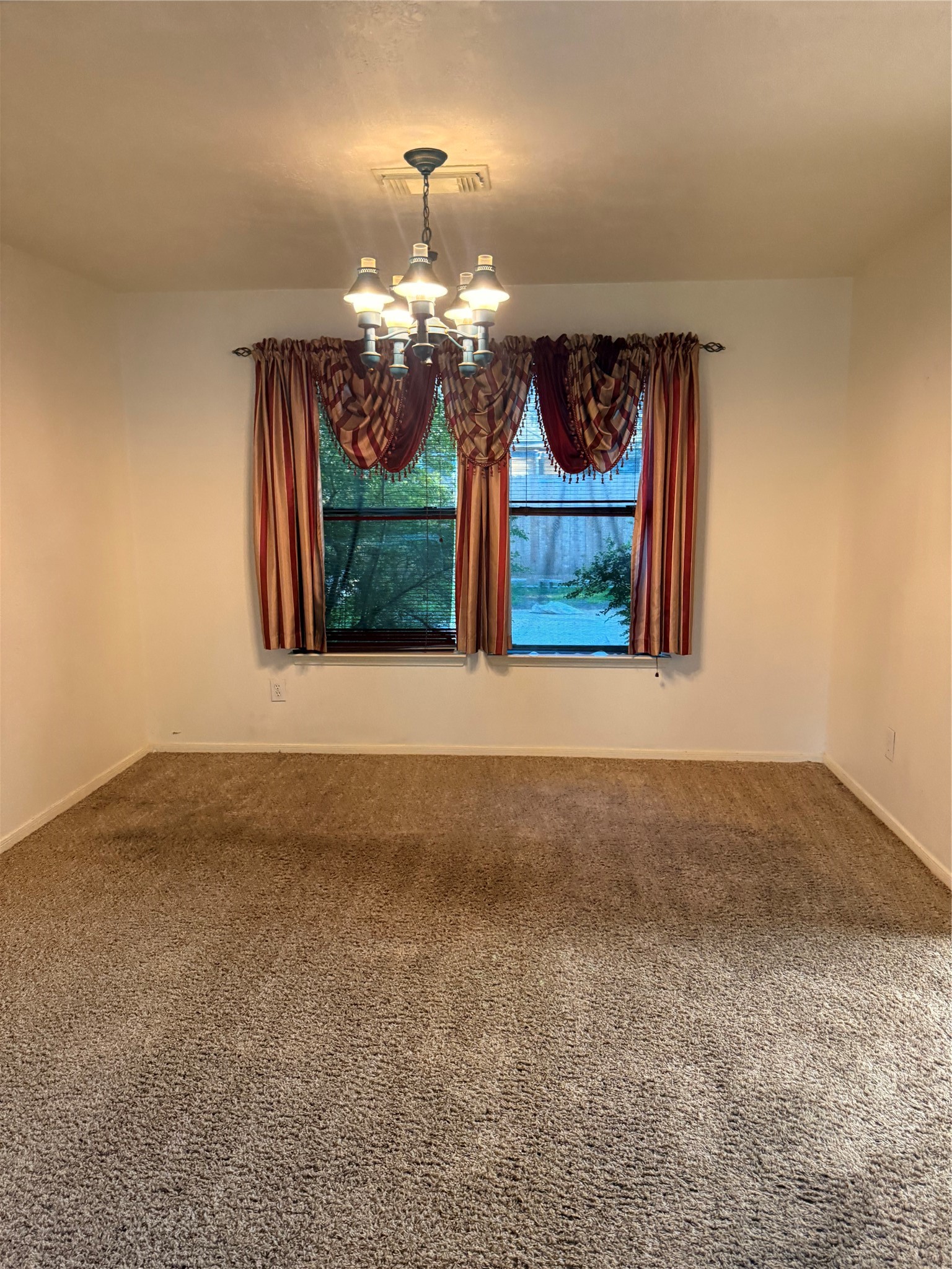 5619 Roserock Lane Spring, TX 77379 - Photo 3 of 14 a view of a room with window and chandelier