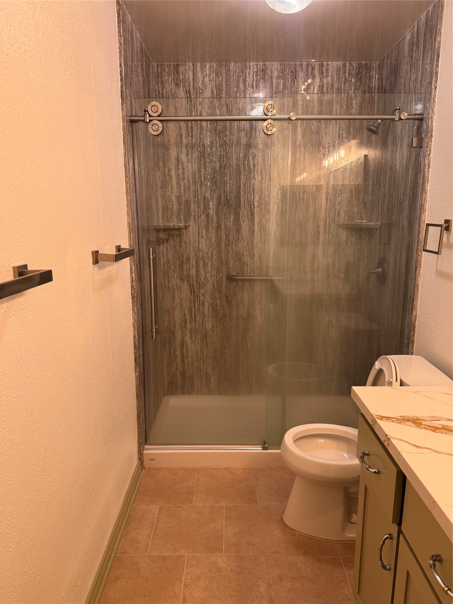 5619 Roserock Lane Spring, TX 77379 - Photo 9 of 14 a bathroom with a shower a toilet and a sink